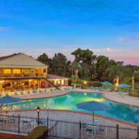 pool and clubhouse at dusk